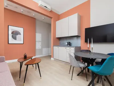 a kitchen and dining room with a table and chairs at Main square - Apartment with 2 bedrooms in Kraków