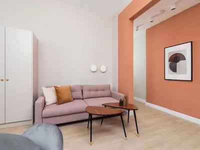 a living room with a couch and a table at Main square - Apartment with 2 bedrooms in Kraków