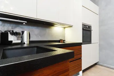 a kitchen with a sink and a microwave at Luxury Apartment - Kazimierz District in Kraków