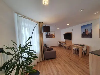 a living room with a couch and a table at Old Town Apartments - B12 in Kraków