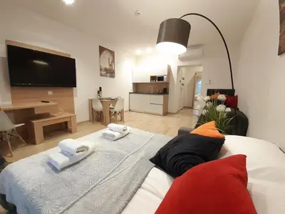 a bedroom with a bed with two towels on it at Old Town Apartments - B34 in Kraków