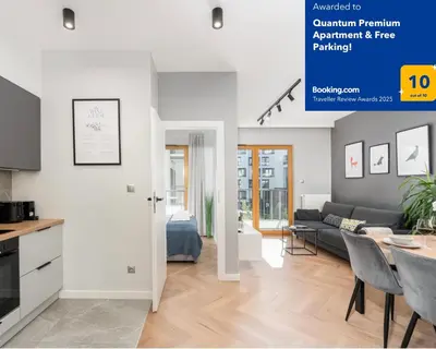 a living room with a couch and a table at Quantum Premium Apartment & Free Parking! in Kraków