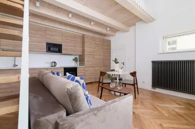a living room with a couch and a table at 3 bedroom Apartment with the balcony - Rejtana 10 in Kraków