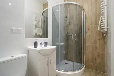 a bathroom with a shower and a toilet and a sink at 2 bedroom apartment - Old Town - Zwierzyniecka 8 street in Kraków