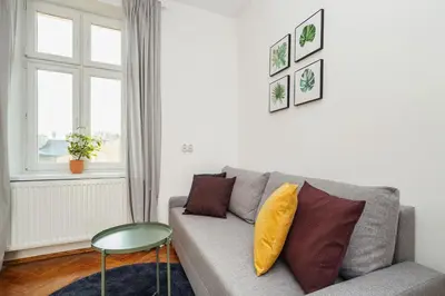 a living room with a couch and a table at 2 bedroom apartment - Old Town - Zwierzyniecka 8 street in Kraków