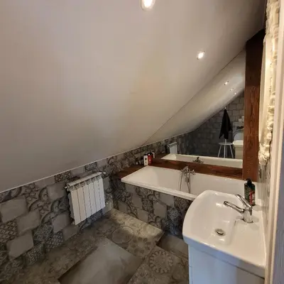 a bathroom with a sink and a bath tub at Dom dla 6 osób in Oświęcim