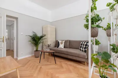 a living room with a couch and a table at 2 - bedroom Apartment with balcony - Rejtana 10 in Kraków