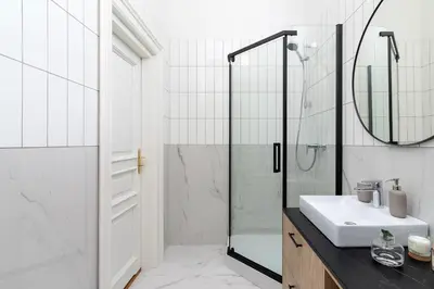 a bathroom with a sink and a shower at 2 - bedroom Apartment with balcony - Rejtana 10 in Kraków