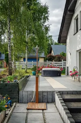 a wooden stand in the middle of a garden at Villa Marta in Trzebinia