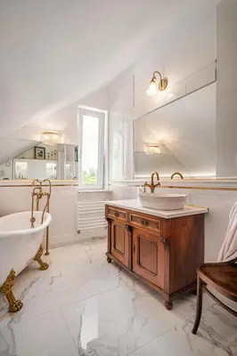 a bathroom with a tub and a sink and a bath tub at Villa Marta in Trzebinia