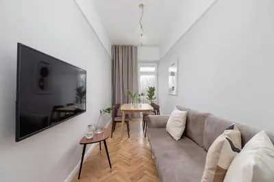 a living room with a couch and a table at 2 - bedroom Apartment with balcony - Rejtana 10 in Kraków