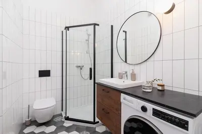 a bathroom with a toilet sink and a mirror at 2 - bedroom Apartment with balcony - Rejtana 10 in Kraków