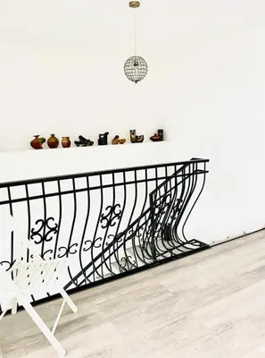 a black and white staircase with shoes on a shelf at Domek u Gosi in Zator