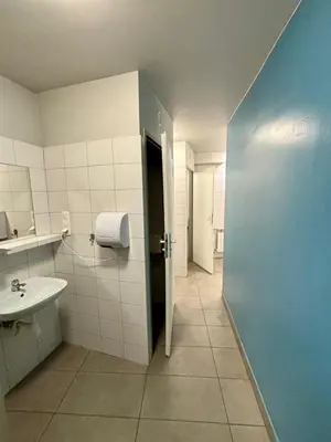 a bathroom with a sink and a toilet at Art Inn Space in Kraków
