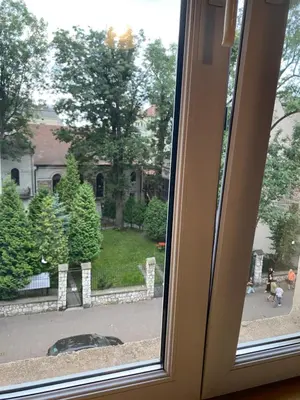 a window with a view of a street at Art Inn Space in Kraków