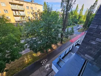 an overhead view of a bench on the side of a building at Apartament na Krowodrzy in Kraków
