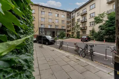 two bikes parked on a sidewalk in front of buildings at Old Town Standard Studio by BookingHost in Kraków