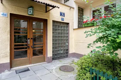 a entrance to a building with a wooden door at Old Town Standard Studio by BookingHost in Kraków