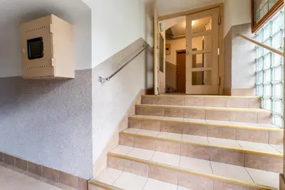 a set of stairs in a building with a door at Old Town Standard Studio by BookingHost in Kraków