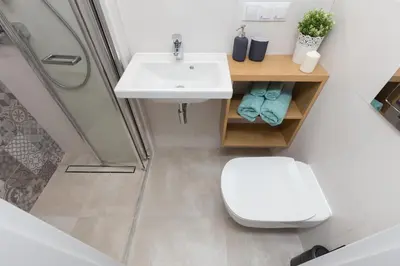 a bathroom with a sink and a toilet and a shower at Cozy 1-bedroom apartment, Heart of Cracow in Kraków