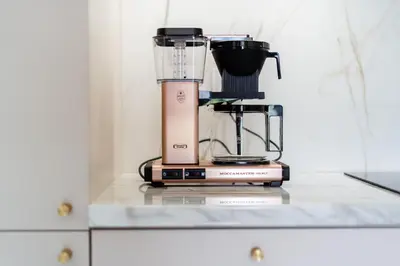 a blender sitting on top of a counter at Lema Apartment near Tauron Arena in Kraków