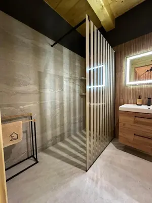 a bathroom with a shower and a sink at Dom Na Brzegu in Limanowa
