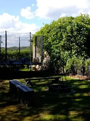 a garden with a ping pong table in the grass at Świerkowe zacisze 13km energylandia in Wożniki