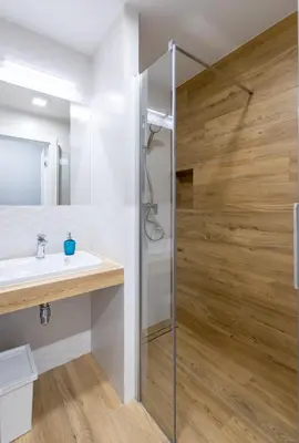 a bathroom with a shower and a sink at Rajska 3 Grey Apartment Krakow City in Kraków