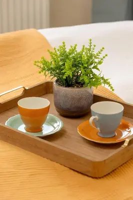 a wooden tray with two cups and a potted plant at Centrum Krakowa Piękny Apartament z Balkonem by Rent like home in Kraków