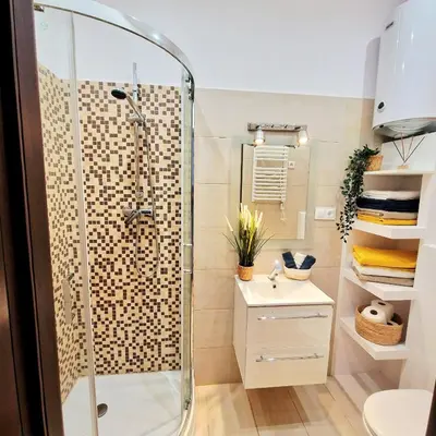a bathroom with a shower and a sink at Old Town Apartments - B6A in Kraków