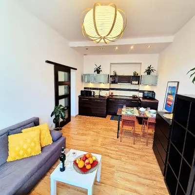 a living room with a couch and a table at Old Town Apartments - B6A in Kraków