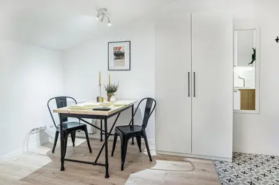 a dining room with a table and chairs at Old Town Apartments - T36b in Kraków