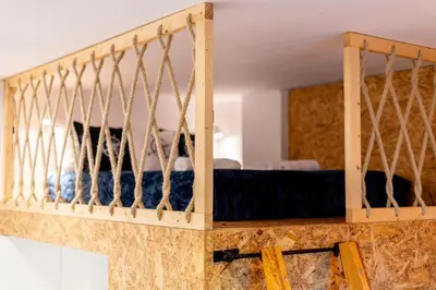 a bedroom with a bed in a room at Lighthouse by Cozyplace in Kraków