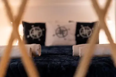 a close up of a bed with two pillows at Lighthouse by Cozyplace in Kraków