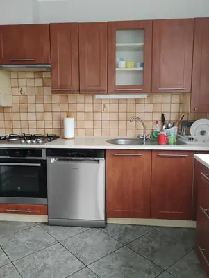 a kitchen with a sink and a dishwasher at Pokoje u Ewy in Limanowa