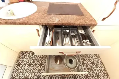 a drawer in a bathroom with a sink at Augustiańska Cozy Apartment A9 in Kraków