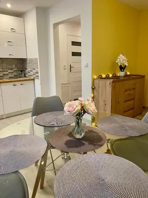 a bedroom with a bed and a table and a desk at Przytulne Apartamenciki tuż przy Termach i Parku, nieopodal szlak na Turbacz, GPN, KGP in Poręba Wielka