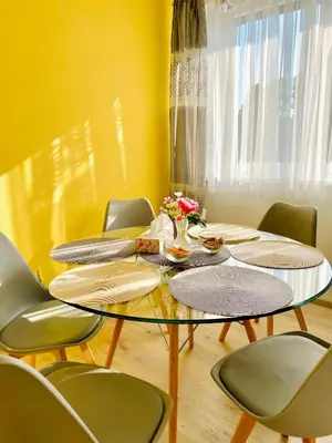 a living room with a couch and a table at Przytulne Apartamenciki tuż przy Termach i Parku, nieopodal szlak na Turbacz, GPN, KGP in Poręba Wielka
