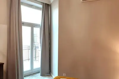 a room with a large window and a room with at Luxury Apartment - Rakowicka R15 in Kraków