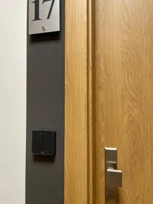 a door with the number on it next to it at Rent Apartment in Wieliczka