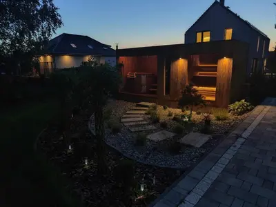 a house with a garden in front of it at Apartament Miętowe Marzenie in Chrzanów