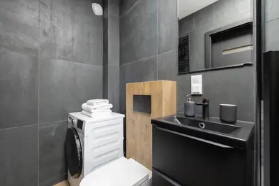 a bathroom with a toilet and a sink at Ap with a balcony- Podgorze- Kalwaryjska 34 in Kraków