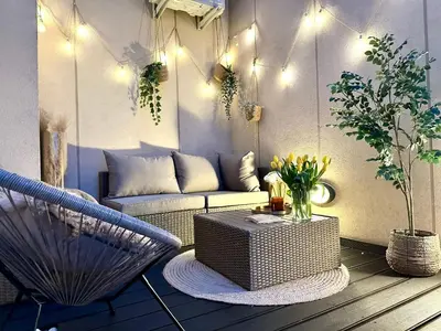 a living room with a couch and a table at Mozarta sky terrace VIP 2-bed apartament in Kraków