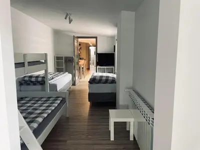 a room with two beds and a hallway at Nocleg blisko Energylandii Zator in Zator