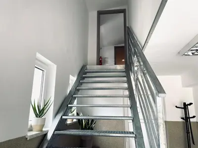 a staircase with glass railings in a house at Nocleg blisko Energylandii Zator in Zator