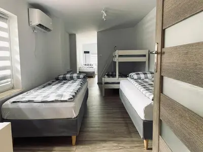 a room with two beds and a door with two beds at Nocleg blisko Energylandii Zator in Zator