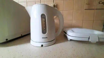 a white blender sitting on a counter next to a toilet at Apartament Sofia in Kraków
