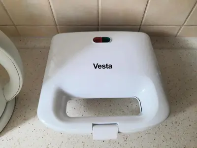 a white toilet seat in a bathroom next to a toilet at Apartament Sofia in Kraków