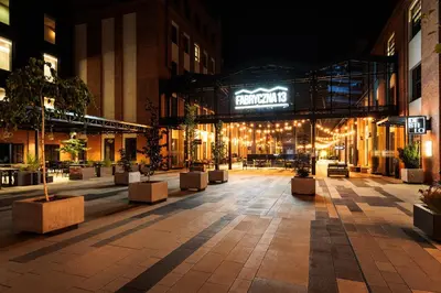an empty courtyard in a building at night at City of the Kings - Riverside B22 in Kraków