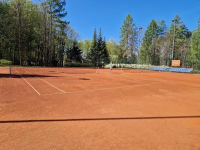 a tennis court with two tennis rackets on it at Słoneczna Skarpa in Rabka-Zdroj